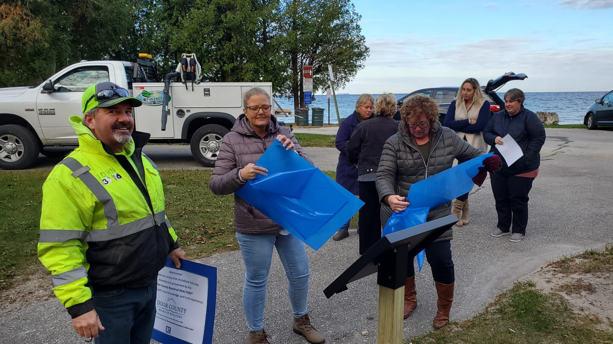 Members of the DCBR Charitable Foundation install a Book Walk Book 